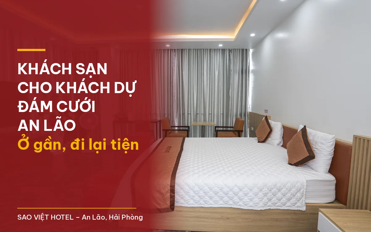 Khách sạn cho khách dự đám cưới An Lão – phòng giường đôi ga trắng, ghế sofa đỏ và bình hoa tại Sao Việt Hotel với tiêu đề bài viết